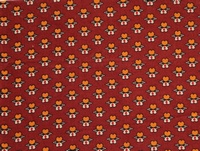 Tela con estampado floral en tonos narjanjas y blancos sobre fondo marrón